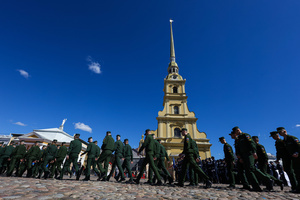 Participants in a theatrical reenactment, military academy cadets, march across Cathedral Square in front of the Peter and Paul Cathedral during the Victory Ball event. A large-scale theatrical reconstruction and flash mob titled "Victory Ball" (Bal Pobedy) takes place on the Cathedral Square of the Peter and Paul Fortress. The event is dedicated to the 81st anniversary of the victory in World War II (WWII). Hundreds of participants, including youth activists, members of the Yunarmia movement, and students in historical and modern military uniforms, perform mass dances and formations. The reconstruction is part of the city-wide celebrations ahead of Victory Day in St. Petersburg.