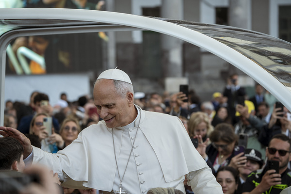 Pope Leo XIV seen greeting a child in Plebiscito Square during the event. Pope Leo XIV met around 30,000 faithful and the authorities of Naples in Piazza del Plebiscito, for the first year of his Pontificate.