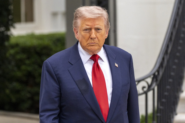 President Trump's hand is seen as he speaks to reporters before departing on Marine One from the South Lawn of the White House, Friday, May 8, 2026, in Washington.