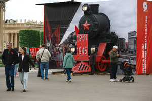 People walk past retro decorations during the celebrating Victory Day at the Exhibition of Achievements of the National Economy (VDNKh) Moscow marked the 81st anniversary of the Soviet victory over Nazi Germany on May 9 with commemorative events across the city honoring those who fought in World War II. Some residents took part in memorial activities remembering the wartime generation.