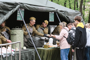 Volunteer wearing military clothing works at a street food kiosk as field kitchen during the celebrating Victory Day at the Exhibition of Achievements of the National Economy (VDNKh) Moscow marked the 81st anniversary of the Soviet victory over Nazi Germany on May 9 with commemorative events across the city honoring those who fought in World War II. Some residents took part in memorial activities remembering the wartime generation.