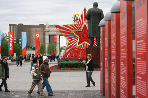 People walk past festive decorations during the celebrating Victory Day at the Exhibition of Achievements of the National Economy (VDNKh) Moscow marked the 81st anniversary of the Soviet victory over Nazi Germany on May 9 with commemorative events across the city honoring those who fought in World War II. Some residents took part in memorial activities remembering the wartime generation.