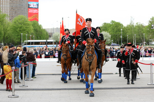 The Kremlin Equestrian School's horsemen with Soviet Union flags seen during the performance dedicated to Victory Day at the Exhibition of Achievements of the National Economy (VDNKh) Moscow marked the 81st anniversary of the Soviet victory over Nazi Germany on May 9 with commemorative events across the city honoring those who fought in World War II. Some residents took part in memorial activities remembering the wartime generation.