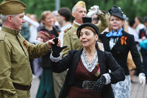 Veterans dance during the Victory Day celebrations at Gorky Park in central Moscow. People wearing vintage clothing and Soviet-era uniforms gathered at Gorky Park, where some participants performed the traditional “Victory Waltz” during commemorations in Moscow. The dance honors the wartime generation and remains a symbolic part of Victory Day celebrations.