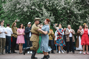 People dance during the Victory Day celebrations at Gorky Park in central Moscow. People wearing vintage clothing and Soviet-era uniforms gathered at Gorky Park, where some participants performed the traditional “Victory Waltz” during commemorations in Moscow. The dance honors the wartime generation and remains a symbolic part of Victory Day celebrations.
