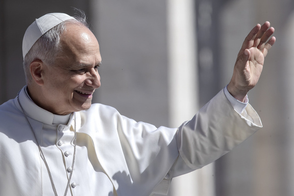 Pope Leo XIV seen waving to the faithful as he arrives for his weekly general audience in St. Peter's square .