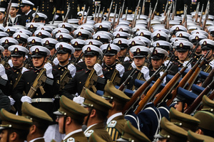 Military personnel parade with weapons during the 147th commemoration of Naval Glories Day. Commemoration number 147 of Naval Glories Day, with the presence of the president of Chile Jose Antonio Kast, in the city of Valparaiso, Chile.