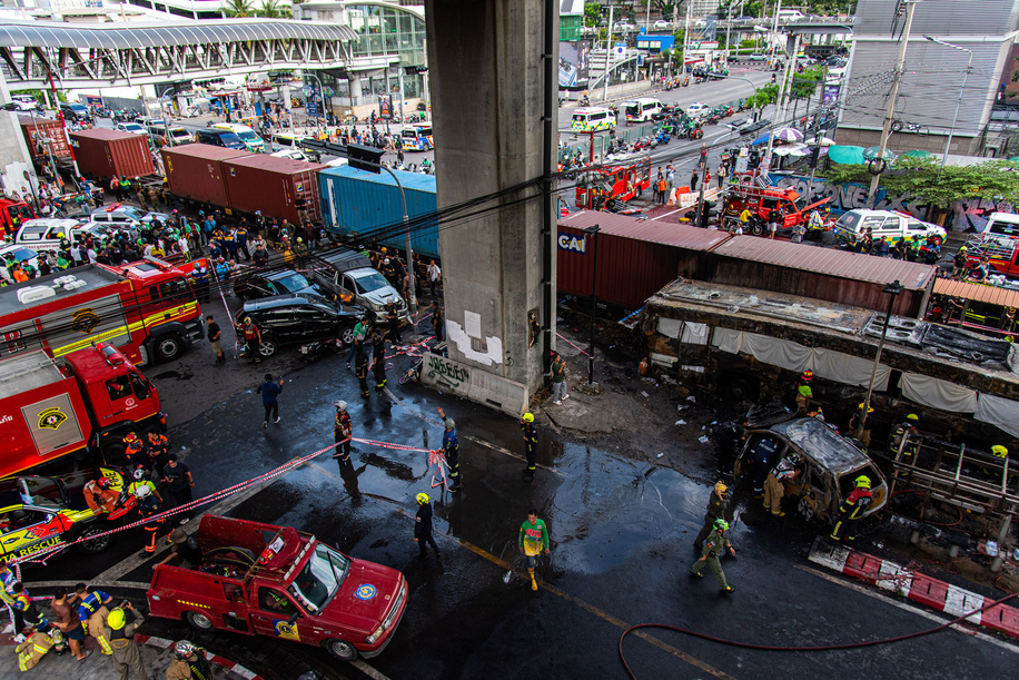 General view of an accident site where a cargo train crashed with a public bus at the Makkasan airport rail link station. At least 8 people were killed and more than 25 people injured in the accident.