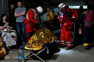 Red Cross medics provide first aid to victims of a Russian missile attack. A large ballistic missile attack pounded Kyiv early on May 24, authorities said, wounding at least five people after Moscow threatened retaliation for strikes in Russian-occupied eastern Ukraine.