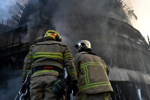 Ukrainian firefighters try to stop fire in a heavily damaged building following Russian strikes in Kyiv. A large ballistic missile attack pounded Kyiv early on May 24, authorities said, wounding at least five people after Moscow threatened retaliation for strikes in Russian-occupied eastern Ukraine.
