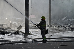 Ukrainian firefighters try to stop fire in a heavily damaged building following Russian strikes in Kyiv. A large ballistic missile attack pounded Kyiv early on May 24, authorities said, wounding at least five people after Moscow threatened retaliation for strikes in Russian-occupied eastern Ukraine.