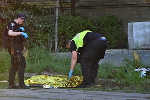 Police officers work at the site of an apartment building damaged during a Russian missile and drone strike, amid Russia's attack on Ukraine. A large ballistic missile attack pounded Kyiv early on May 24, authorities said, wounding at least five people after Moscow threatened retaliation for strikes in Russian-occupied eastern Ukraine.