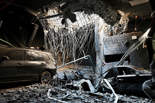 A hole from a rocket explosion in a floor slab and damaged cars in the parking lot of a residential building damaged by a massive Russian missile attack. Ukrainian President Volodymyr Zelenskyy said Russia launched a massive overnight attack on Ukraine on May 24 using around 90 missiles and approximately 600 drones, with Kyiv as the main target. The attack caused deaths and injuries and damaged several landmarks, including the Kyiv Opera, the National Art Museum of Ukraine, the Contracts House, and the Ukrainian National Chornobyl Museum. Civilian infrastructure was also hit, including residential buildings, schools, a water supply facility, and a market.