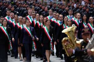 Police officers wearing the tricolour sash march during the parade. Heads of state and government attended the 80th Anniversary of Republic Day celebrations and the traditional military parade through the Imperial Fora. The ceremony, which pays homage to the values ​​of the Republic and the Armed Forces, took place in the heart of the capital before the highest Italian institutional officials and international delegations.