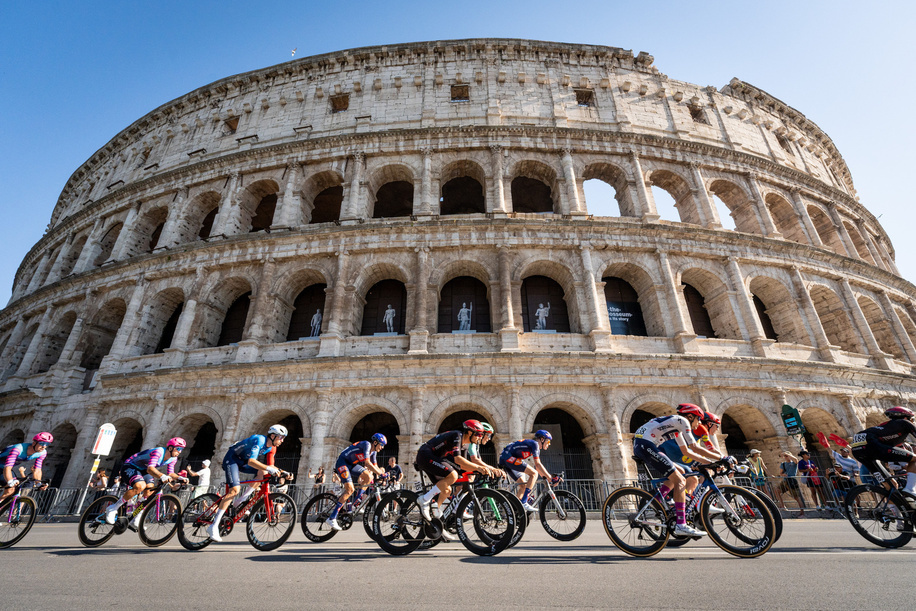 Cyclists seen riding under the Colosseum during the 109th Giro d'Italia 2026 Stage 21, a 131km stage from Rome to Rome s' 1289m.