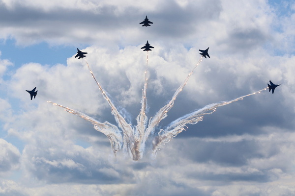 Flight of the aerobatics flight groups of the Russian Air Force "Russian Knights" flying fighters Su-35S at the International Maritime Defense Show Fleet 2026 in Kronstadt.