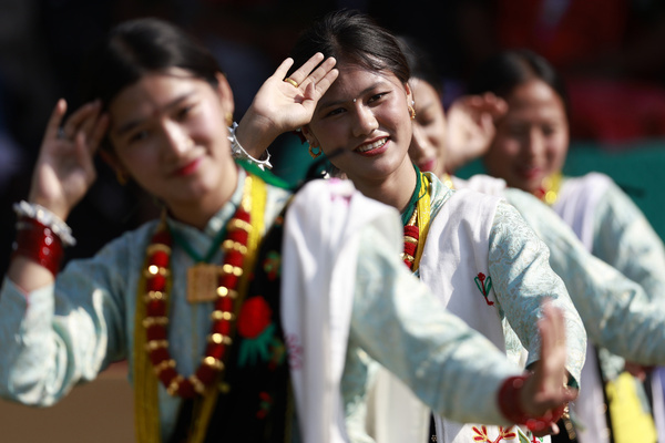 Women from the Magar community clad in traditional attire sing and dance during the Bhume Parva festival, a celebration to worship the earth and nature with prayers for good harvests, prosperity, and protection from natural disasters, in Kathmandu.
