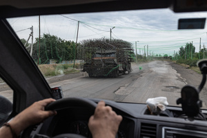 A military vehicle seen protected by metal grilles on a road during an evacuation of civilians by the Ukrainian police unit ‘White Angels’.