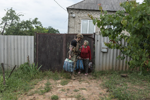 A woman seen being evacuated by the ‘White Angels’ police unit.
