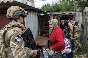 A woman seen being evacuated by the ‘White Angels’ police unit.