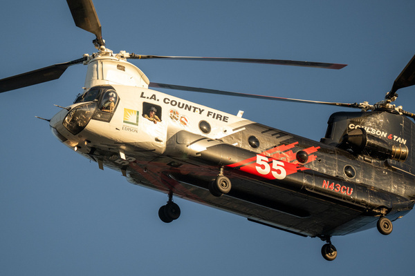 Air and ground firefighting crews battle the Max Fire as flames burn through rugged terrain in Los Angeles County. Firefighters worked from both the air and the ground to contain the fast-moving wildfire amid dry and windy conditions.