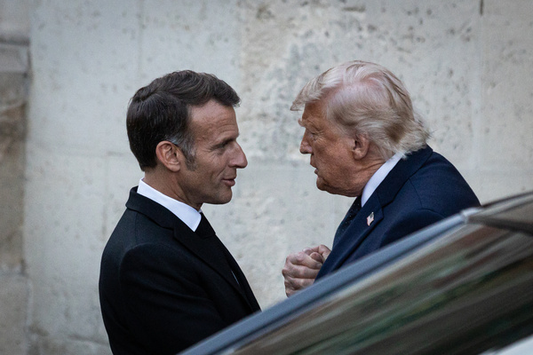French President Emmanuel Macron (L) is seen welcoming the President of the United States of America, Donald Trump (R), for a dinner at the Palace of Versailles. French President Emmanuel Macron and First Lady Brigitte Macron hosted United States President Donald Trump for a working dinner at the Palace of Versailles. The historic venue serves as a prominent symbol of Franco-American friendship, marking the upcoming 250th anniversary of U.S. independence at the very site where the 1783 treaty recognizing the sovereignty of the United States was signed.