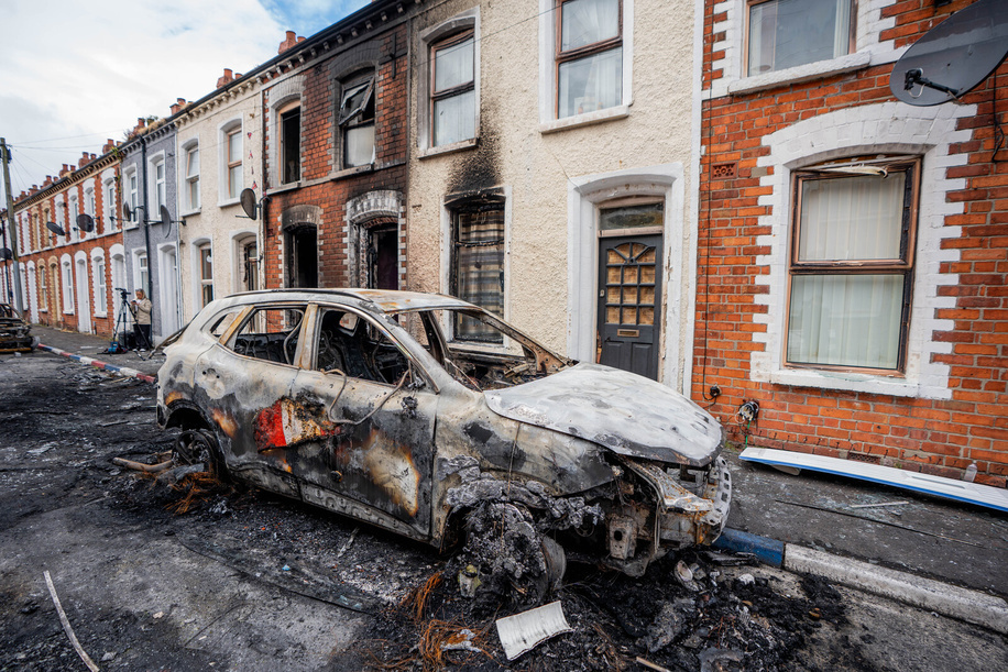 A burnt-out car seen in the Templemore area following the night riots. The city erupted into flames as locals took to the streets to protest against the stabbing of a North Belfast man by a Sudanese national refugee.  Road blockades were set up all over Belfast, bringing much of the city to a standstill. The protestors are demanding a stop to immigration into Northern Ireland.