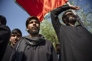 Shia Muslims walk in a Muharram procession while reciting nohas, elegiac poems mourning the martyrdom of Imam Hussain and his companions in the Battle of Karbala. The recitations form an integral part of Muharram commemorations observed by Shia communities worldwide. Muharram is the first month of the Islamic calendar. Shia Muslims observe Muharram as a period of mourning to commemorate the martyrdom of Imam Hussain, the grandson of Prophet Muhammad. Imam Hussain was martyred on the 10th day of Muharram, during the historic Battle of Karbala in 680 CE.