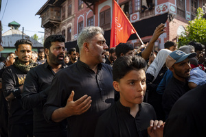Shia Muslims walk in a Muharram procession while reciting nohas, elegiac poems mourning the martyrdom of Imam Hussain and his companions in the Battle of Karbala. The recitations form an integral part of Muharram commemorations observed by Shia communities worldwide. Muharram is the first month of the Islamic calendar. Shia Muslims observe Muharram as a period of mourning to commemorate the martyrdom of Imam Hussain, the grandson of Prophet Muhammad. Imam Hussain was martyred on the 10th day of Muharram, during the historic Battle of Karbala in 680 CE.