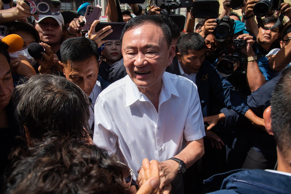 Thaksin Shinawatra a former Thailand Prime Minister, attends to cast his vote at a polling station during the Bangkok Governor election in Bang Phlat district. It was the first time in 20 years the former Prime Minister had exercised his voting right in Thailand since he was deposed in a military coup in 2006.