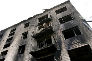 An apartment building remains partially destroyed by a missile strike. Following a devastating overnight bombardment in which Russia launched 74 missiles and 496 attack drones, Kyiv has declared July 3, 2026, a city-wide Day of Mourning to honor the victims. At least 25 people were killed and over 80 injured across the capital as direct strikes heavily damaged residential apartment blocks, leaving active search and rescue operations scrambling to locate residents still believed to be trapped under the rubble.