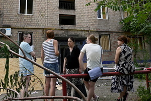 Local residents near a damaged residential building as a result of a missile strike. Following a devastating overnight bombardment in which Russia launched 74 missiles and 496 attack drones, Kyiv has declared July 3, 2026, a city-wide Day of Mourning to honor the victims. At least 25 people were killed and over 80 injured across the capital as direct strikes heavily damaged residential apartment blocks, leaving active search and rescue operations scrambling to locate residents still believed to be trapped under the rubble.