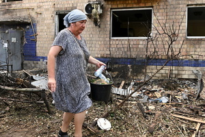 Local resident walks near a damaged residential building as a result of a missile strike. Following a devastating overnight bombardment in which Russia launched 74 missiles and 496 attack drones, Kyiv has declared July 3, 2026, a city-wide Day of Mourning to honor the victims. At least 25 people were killed and over 80 injured across the capital as direct strikes heavily damaged residential apartment blocks, leaving active search and rescue operations scrambling to locate residents still believed to be trapped under the rubble.