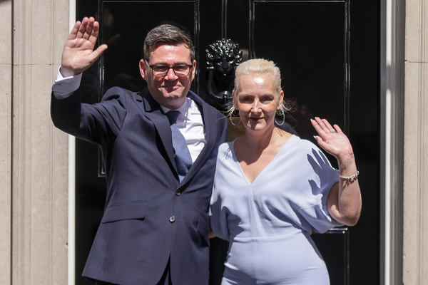 UK Prime Minister Andy Burnham and wife Marie-France van Heel pose for photos outsite No.10 Downing Street.