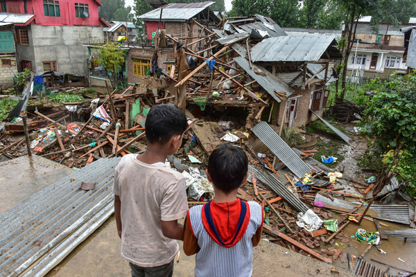 Kashmiri children gather near a blown-up house of Haroon Ganai, a militant suspected in policeman's killing, in Hassanpora, south of Srinagar, the summer capital of Jammu and Kashmir. A day after a police officer was killed in a militant attack in south Kashmir’s Anantnag district, authorities on Thursday demolished the houses of two militants in the area. Security agencies have not said whether the two militants were linked to the killing. Since the attack, police said over 2,500 people are detained as suspects.