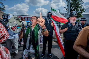 Pro-Palestinian protestor chants slogans through a megaphone during a rally outside Elbit Systems weapons factory. Pro-Palestinian protestors gathered outside Elbit Systems factory in Filton, Bristol to accuse the arms company of supplying Israel with weaponry and drones for its war in Gaza.