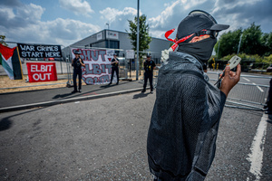 Police Officers guard the Elbit Systems factory as protesters gather during the rally. Pro-Palestinian protestors gathered outside Elbit Systems factory in Filton, Bristol to accuse the arms company of supplying Israel with weaponry and drones for its war in Gaza.