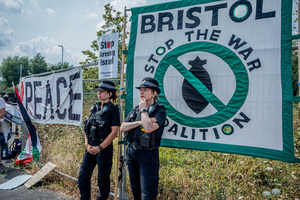 Police Officers guard the Elbit Systems factory during the rally. Pro-Palestinian protestors gathered outside Elbit Systems factory in Filton, Bristol to accuse the arms company of supplying Israel with weaponry and drones for its war in Gaza.