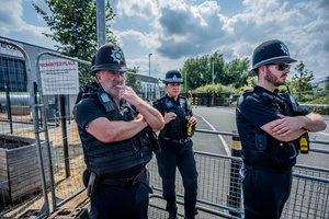 A cordon of Police Officers guard the Elbit Systems factory during the rally. Pro-Palestinian protestors gathered outside Elbit Systems factory in Filton, Bristol to accuse the arms company of supplying Israel with weaponry and drones for its war in Gaza.