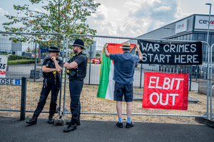 Police officers patrol outside the premises of arms manufacturer Elbit Systems during the demonstration. Pro-Palestinian protestors gathered outside Elbit Systems factory in Filton, Bristol to accuse the arms company of supplying Israel with weaponry and drones for its war in Gaza.