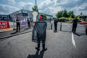 Police Officers guard the Elbit Systems factory during the rally. Pro-Palestinian protestors gathered outside Elbit Systems factory in Filton, Bristol to accuse the arms company of supplying Israel with weaponry and drones for its war in Gaza.