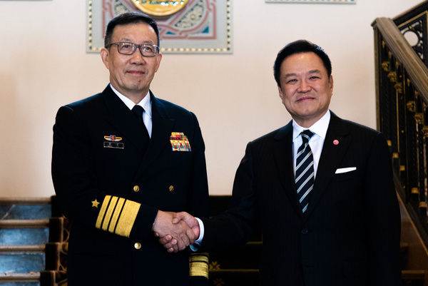 Chinese Defense Minister Admiral Dong Jun (L) shakes hands with Thai Prime Minister Anutin Charnvirakul (R) during a meeting at Government House in Bangkok.