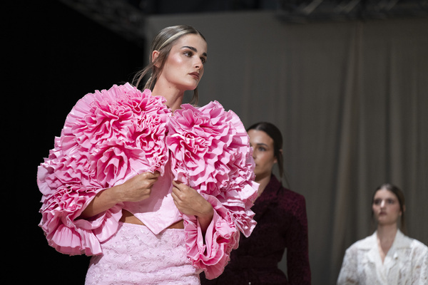 A model walks the runway wearing a design by Romanian designers during Momad Fashion Week de Madrid in IFEMA