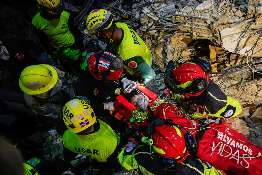 Ecuadorian and Dominican firefighters transport the rescued 12-year-old boy, Carlos, during the operations in La Guaira. The Venezuelan government declared a state of emergency and, with support from international rescue teams, launched large-scale search, rescue, and humanitarian operations following the devastating earthquakes that struck the country's northern coast. The response came after powerful earthquakes on June 24, 2026, caused widespread destruction in Caracas, La Guaira, and surrounding areas, resulting in thousands of deaths and injuries.