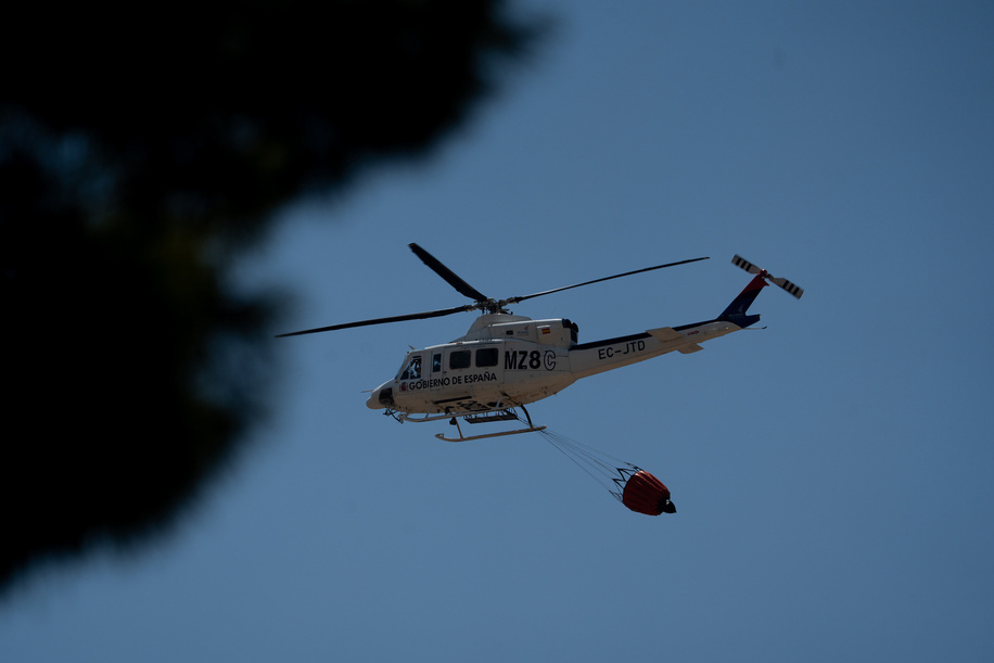 A Spanish military helicopter is seen during the Los Gallardos wildfire in Almeria. Wildfire in the municipalities of Los Gallardos and Bedar, Almeria province, southern Spain. According to the latest official reports, at least, 12 people have been killed and 23 remain missing. The fire has burned approximately 3200 hectares.