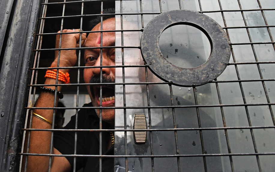A demonstrator of the Cockroach Janta Party (CJP) is seen shouting slogans from inside a police van after being detained during a protest in support of climate activist and education reformer Sonam Wangchuk in Mumbai. Climate activist and education reformer Sonam Wangchuk began an indefinite hunger strike at Delhi's Jantar Mantar in solidarity with the Cockroach Janta Party (CJP), a youth-led movement protesting alleged paper leaks and irregularities in major national medical entrance examinations. Wangchuk joined student-led demonstrations calling for the resignation of Union Education Minister Dharmendra Pradhan and demanding greater accountability and reforms in India's education system.