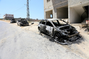 General view of burned-out cars along the street after an attack by Jewish settlers on Palestinian homes. Jewish settlers set fire to cars, threw stones at homes, and wrote Hebrew slogans on houses in Jalud village, south of Nablus in the West Bank. They also damaged power lines between the villages of Jalud and Telfit, near Nablus in the West Bank.