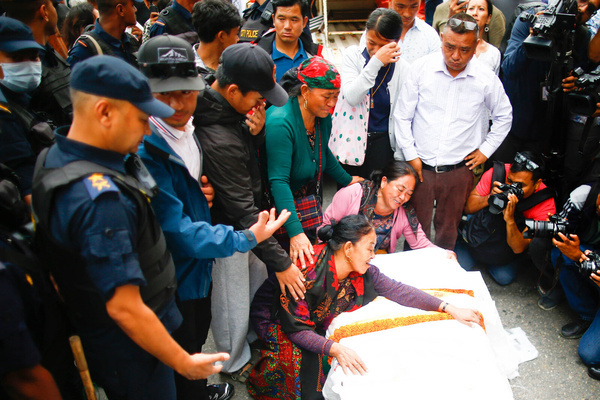 Relatives mourn over the coffin containing the body of renowned Nepali mountaineer Pur Bahadur Gurung (Yukta) at Tribhuvan International Airport. Yukta, the Vice President of the Nepal Mountaineering Association, Gandaki Province, was among the climbers who died on avalanche on Pakistan's Broad Peak, was the first victim to be recovered from the avalanche site.