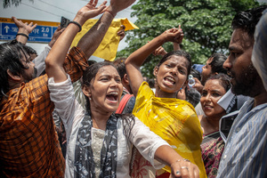 Demonstrating students dance on the street during a water cannon deployment. Students staged a march to the state assembly, amplifying ongoing protests against alleged irregularities in examinations conducted by the Jharkhand Public Service Commission and the Jharkhand Staff Selection Commission.