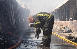 A firefighter seen drinking water from a hose amidst the ruins of the Pochayna book market following a Russian attack . On the night of August 16, 2026, a massive Russian air strike on Kyiv caused severe destruction and a large-scale fire at the "Pochaina" book market (formerly known as Petrivka) in the Obolon district. The enemy attack completely burned down several rows of trading pavilions containing books and stationery just ahead of the new school year. Emergency response teams worked at the scene to extinguish the blaze, which spread across a vast area. According to preliminary reports from city authorities, at least three people were injured as a result of the overnight attack. The destroyed marketplace had operated in the capital for nearly 30 years and stood as one of the largest hubs for book trade in Ukraine.